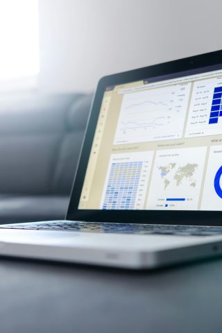 pexels-photo-577210-577210 Sleek laptop showcasing data analytics and graphs on the screen in a bright room.